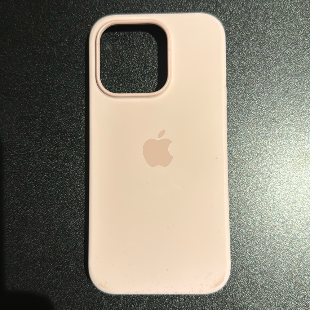 Apple silicone case in Chalk Pink for iPhone 14 Pro.
